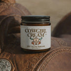 Jar of Cowgirl Cream on a leather surface