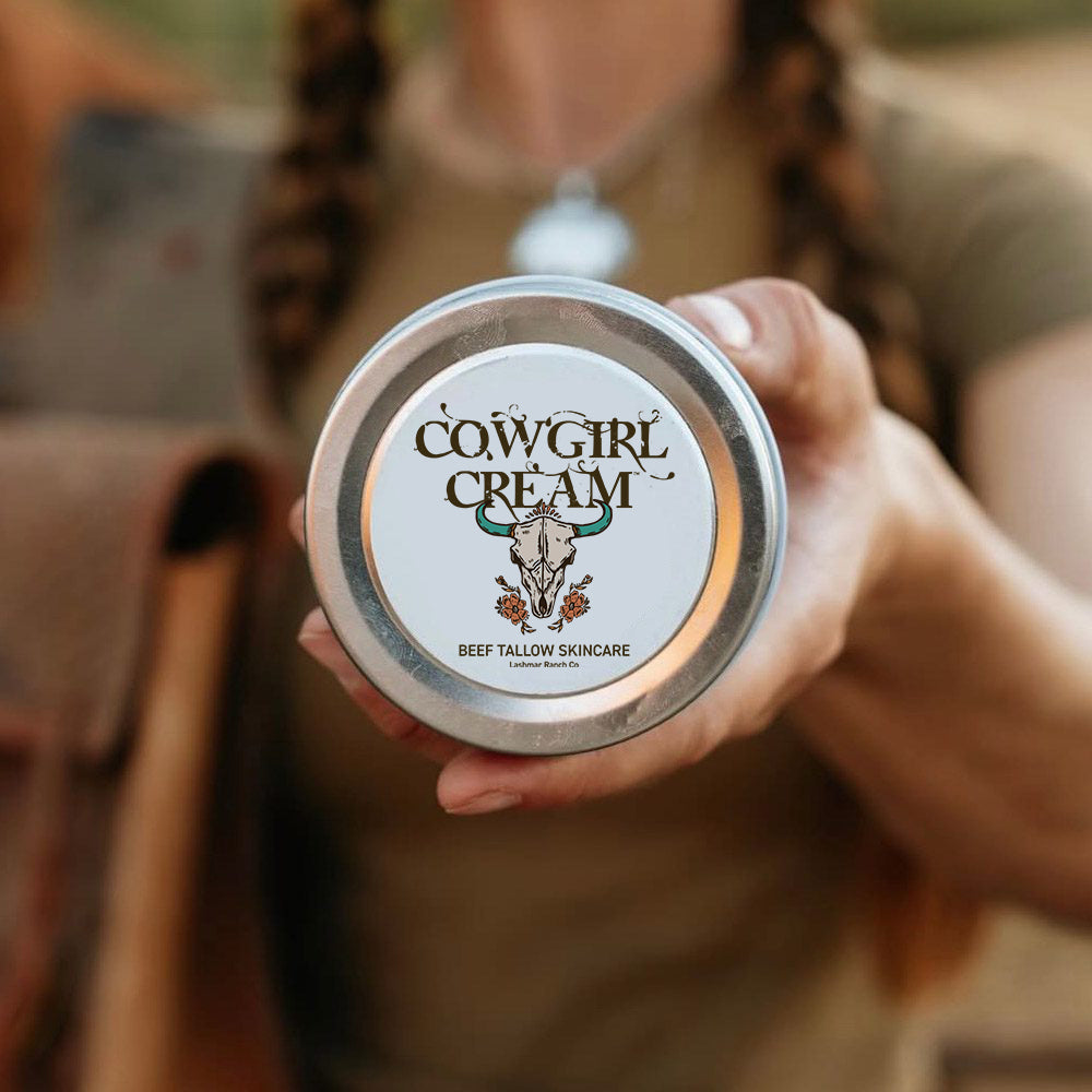 Person holding a container of Cowgirl Cream skincare product